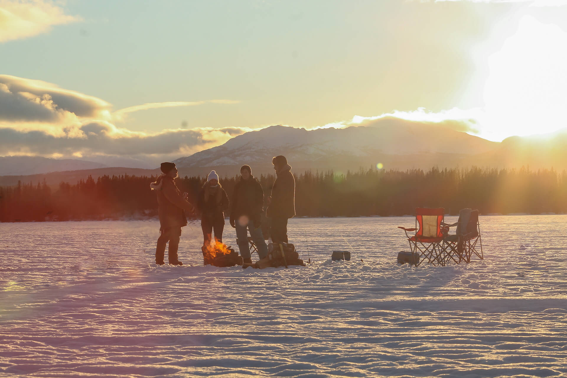 Ice Fishing at Red Cariboo Resort: Ice fishing is one of the most popular winter activity in Canada but you have to dress warm because you will be outside for hours.
